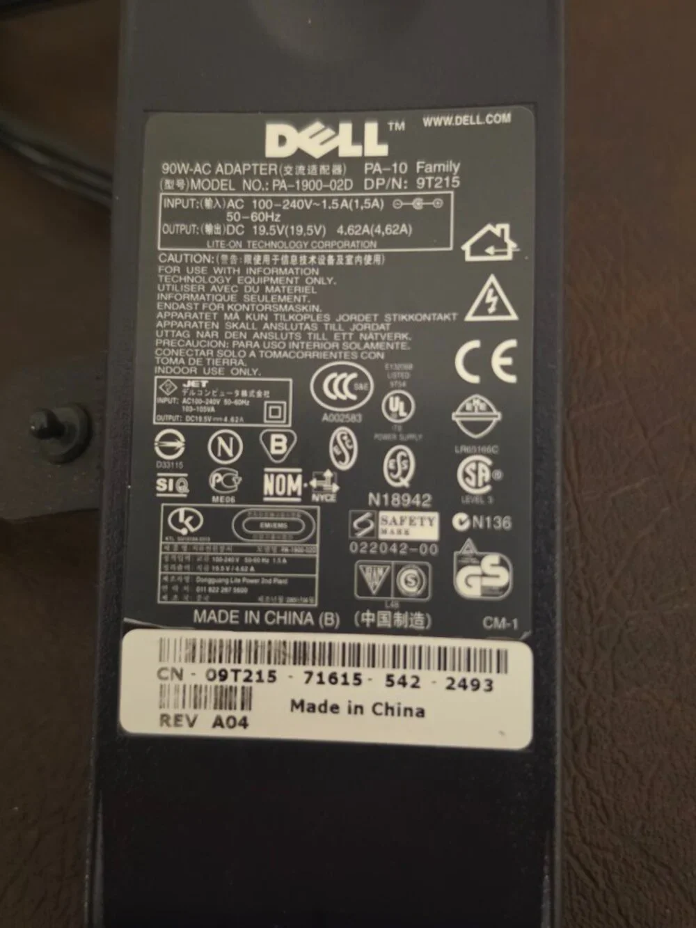 The Dell 90W Laptop Adapter Power Supply Charger -